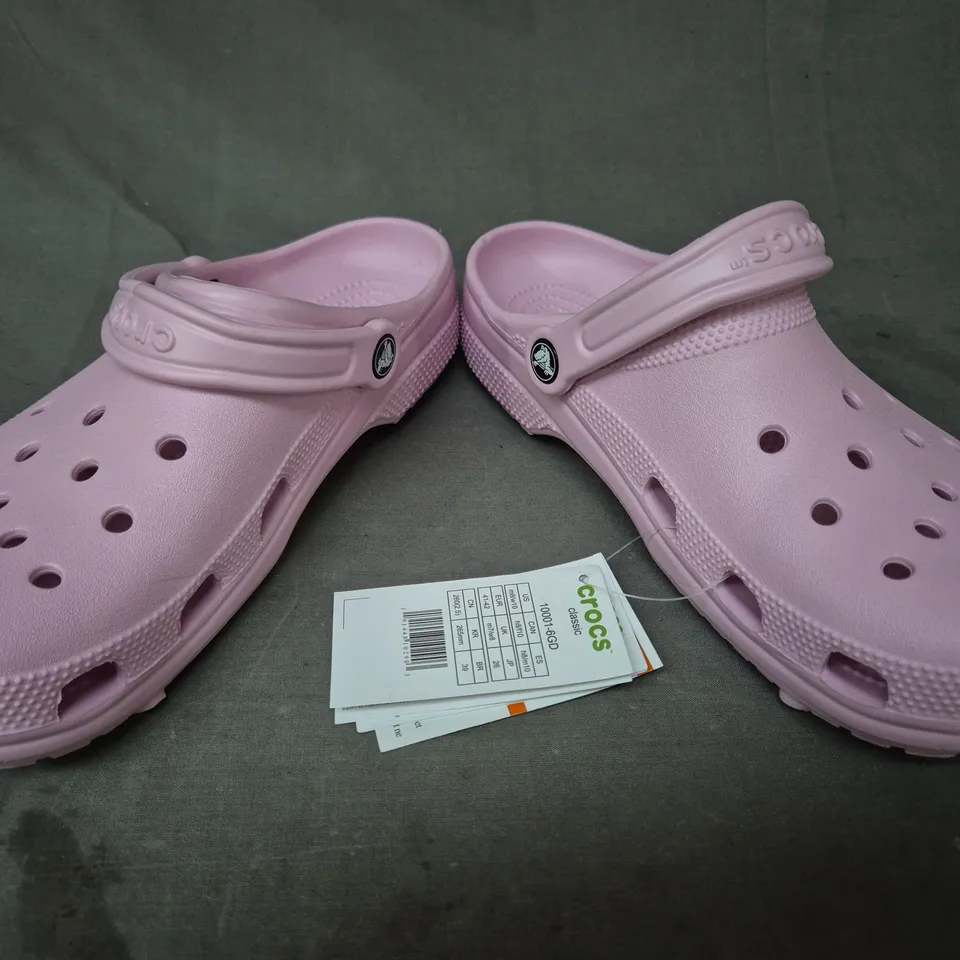 PAIR OF CROCS CLASSIC CLOGS IN PINK UK SIZE M7/W8