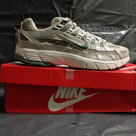 BOXED PAIR OF NIKE P-6000 TRAINERS IN CREAM/CLAY GREEN SIZE UK 11