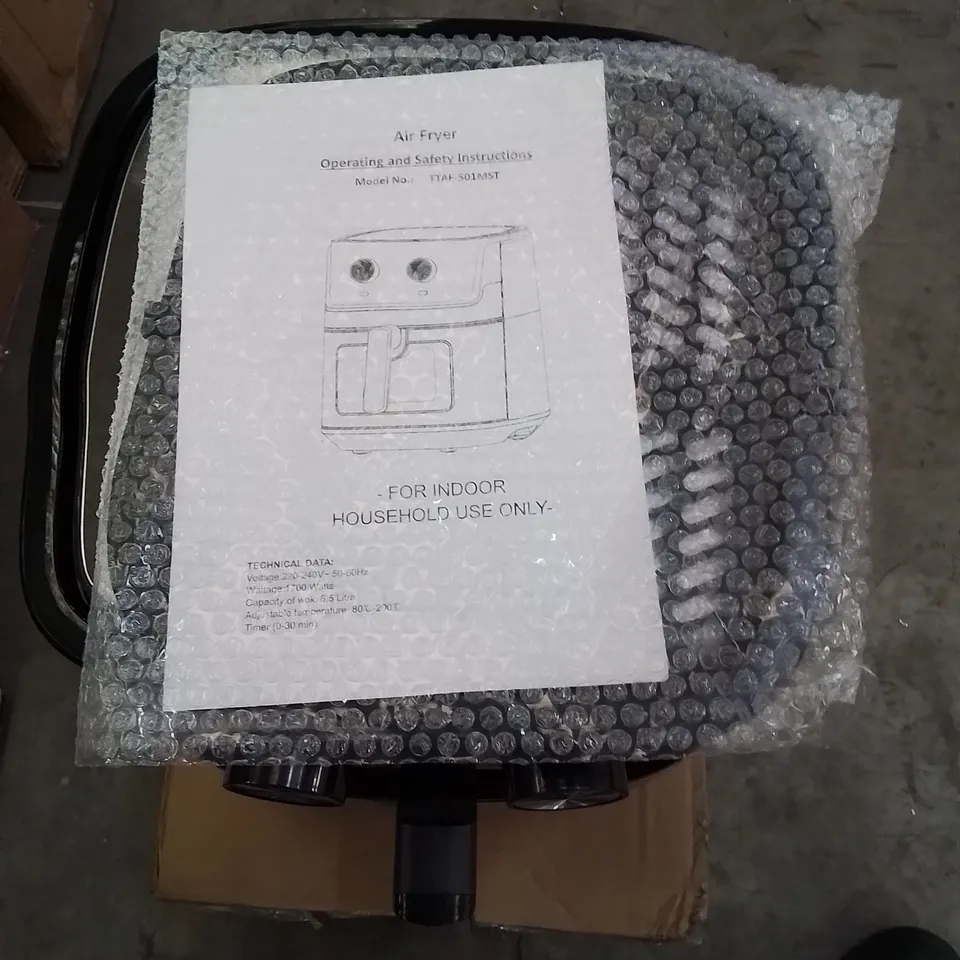 A BOXED TTAF-501MST AIR FRYER IN BLACK