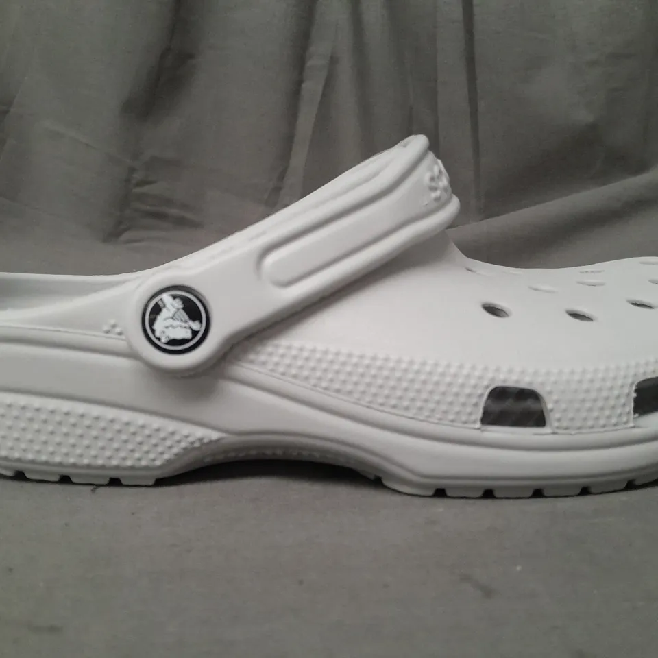 PAIR OF CROCS CLASSICS IN GREY UK SIZE M5/W6