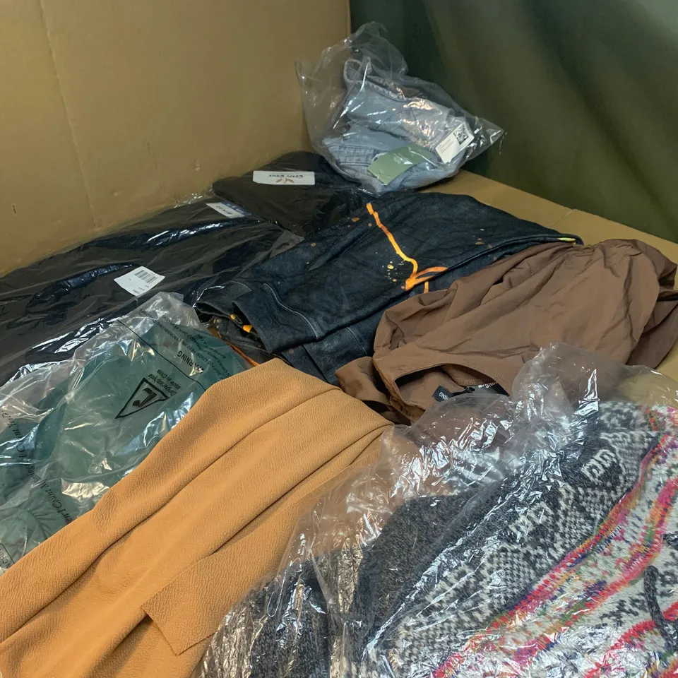 Medium box of assorted clothing items to include trousers, t-shirts and jackets