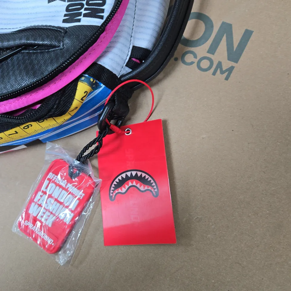 SPRAYGROUND LONDON FASHION WEEK BACKPACK – MULTICOLOURED GRAPHIC DESIGN WITH TAGS