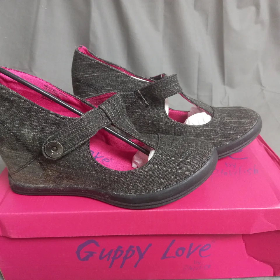 BOX OF APPROXIMATELY 7 BLACK  GUPPY LOVE BY BLOWFISH SHOES IN VARIOUS SIZES 