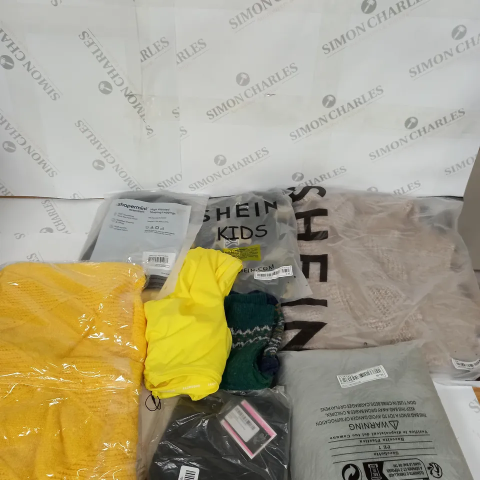 LARGE BOX OF ASSORTED CLOTHING ITEMS IN VARIOUS COLOURS AND SIZES INCLUDING TROUSERS , TOPS AND JUMPERS