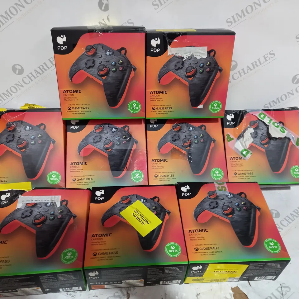 9 BOXED ATOMIC CARBON WIRED XBOX CONTROLLERS