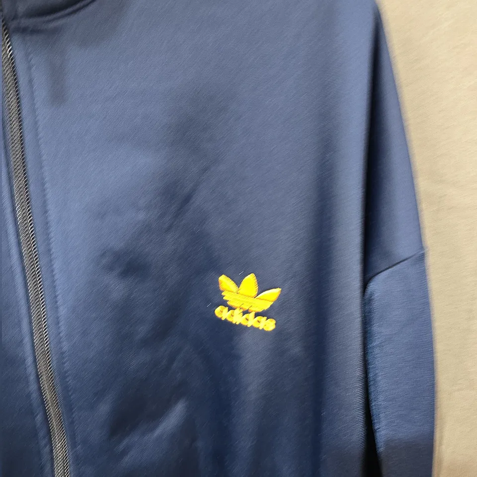 ADIDAS NAVY BLUE TRACK JACKET WITH YELLOW STRIPES – SIZE XL