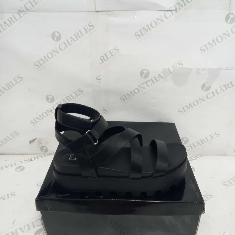 BOXED PAIR OF KOI FOOTWEAR CRIX CHUNKY BLATFORM SANDALS IN BLACK PU - SIZE 6