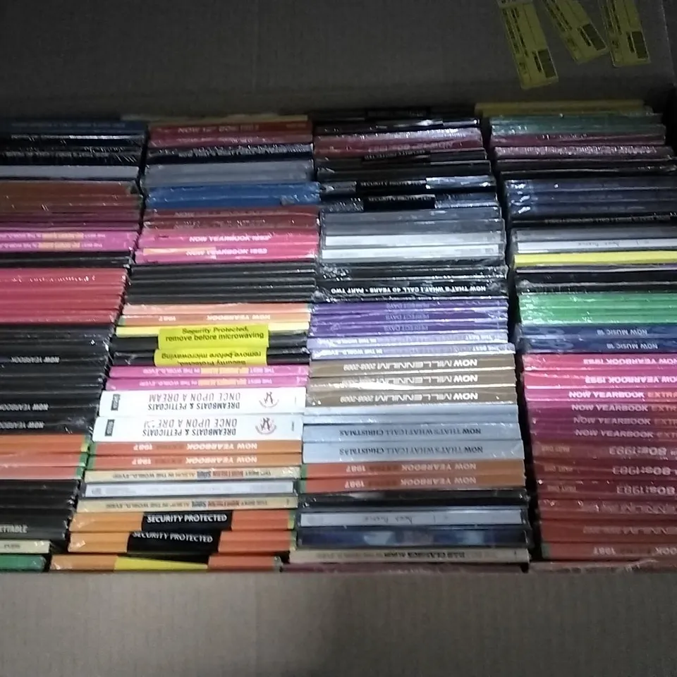 APPROXIMATELY 100 ASSORTED CDS AND DVDS TO INCLUDE NOW MUSIC 18, NOW YEARBOOK, AND NOW THAT'S WHAT I CALL ETC. 