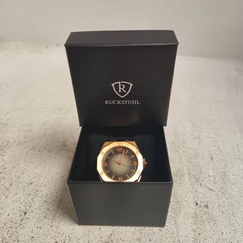 RUCKSTUHL ROSE GOLD-TONE WRISTWATCH – BLACK DIAL, RUBBER STRAP