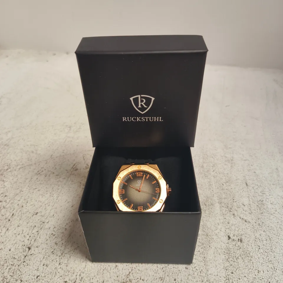 RUCKSTUHL ROSE GOLD-TONE WRISTWATCH – BLACK DIAL, RUBBER STRAP