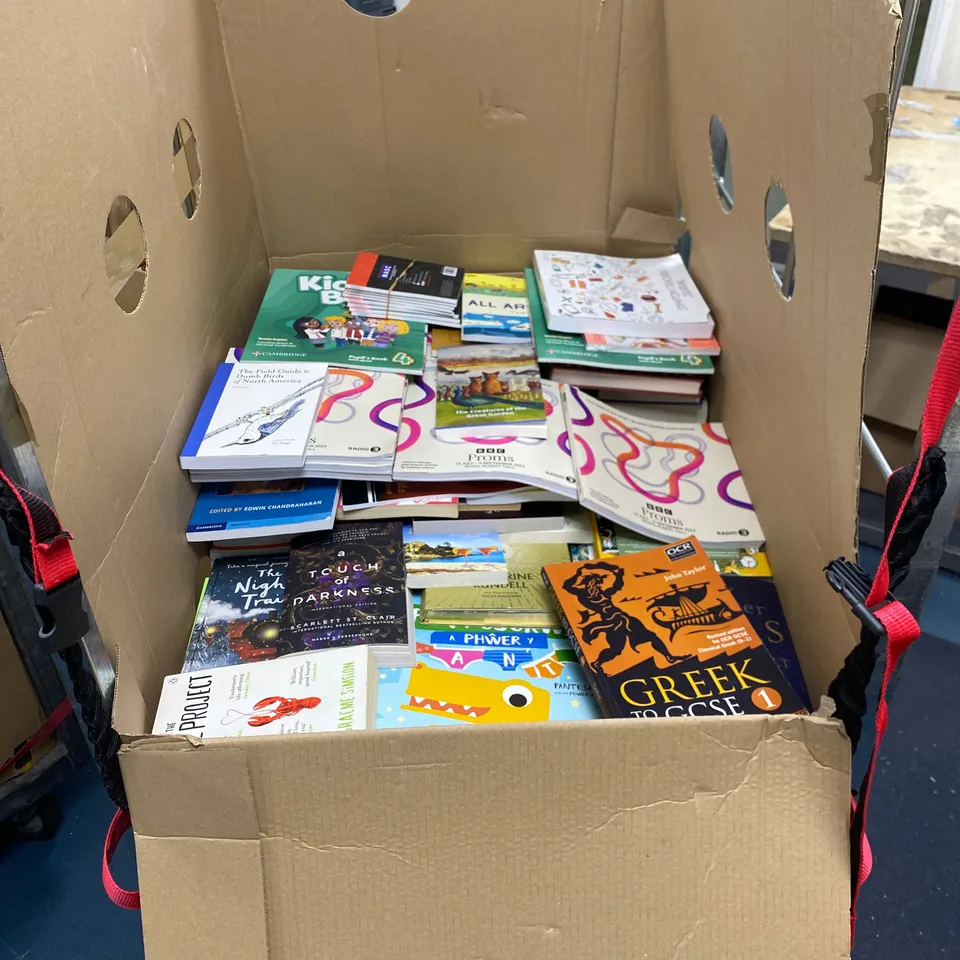 CAGE OF ASSORTED BOOKS TO INCLUDE: GETTING STRONG LOOKING STRONG, THE OBSTACLE IS THE WAY, NOT REMOTELY WORKING, THE BUTLER DID IT, KIDS BOX ETC