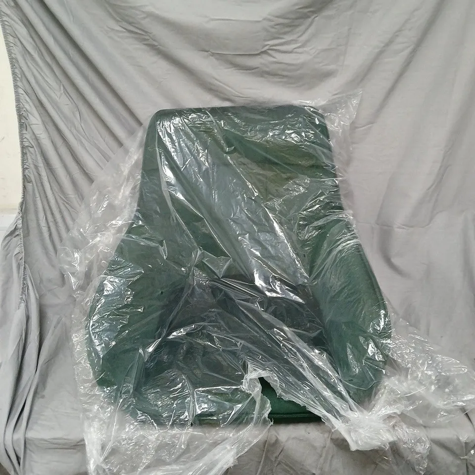 GREEN UPHOLSTERED CHAIR WITH BASE AND LEGS – WRAPPED IN PROTECTIVE PLASTIC