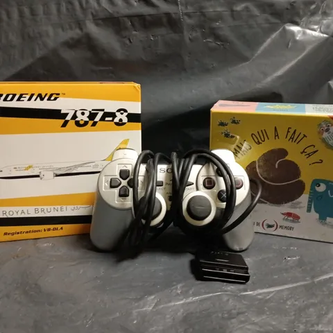APPROXIMATELY 10 ASSORTED TOYS AND GAMES TO INCLUDE PLAYSTATION 2 CONTROLLER, BOEING 787-8 MODEL, ETC
