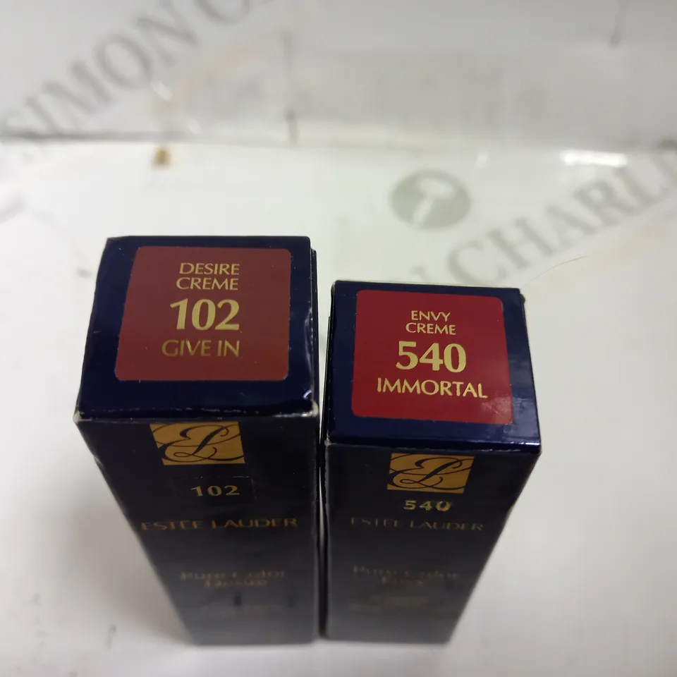 TWO ESTEE LAUDER LIPSTICKS INCLUDING PURE COLOUR DESIRE (102 GIVE IN) AND PURE COLOUR ENVY (540 IMMORTAL)