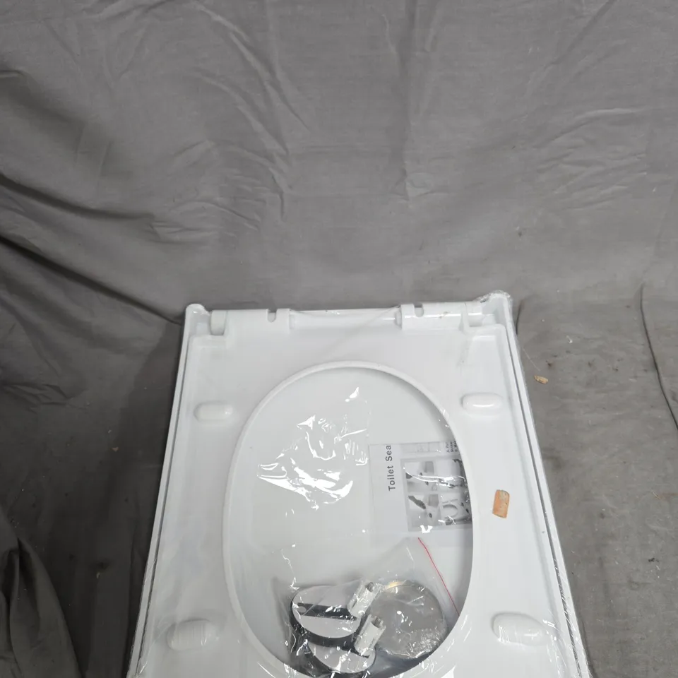 BOX OF APPROXIMATELY 15 ASSORTED ITEMS TO INCLUDE: SILVER TAPE AND TOILET SEAT