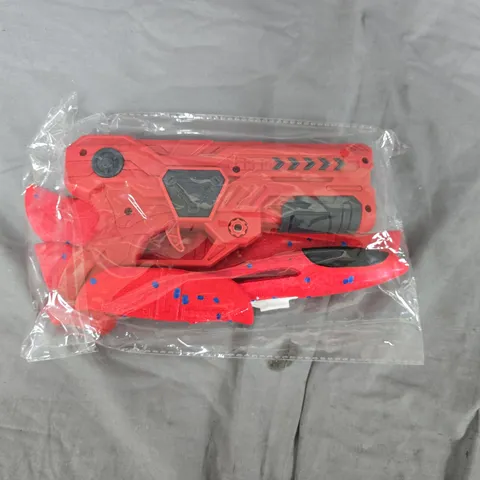 RED TOY BLASTER GUN, SEALED IN PLASTIC BAG