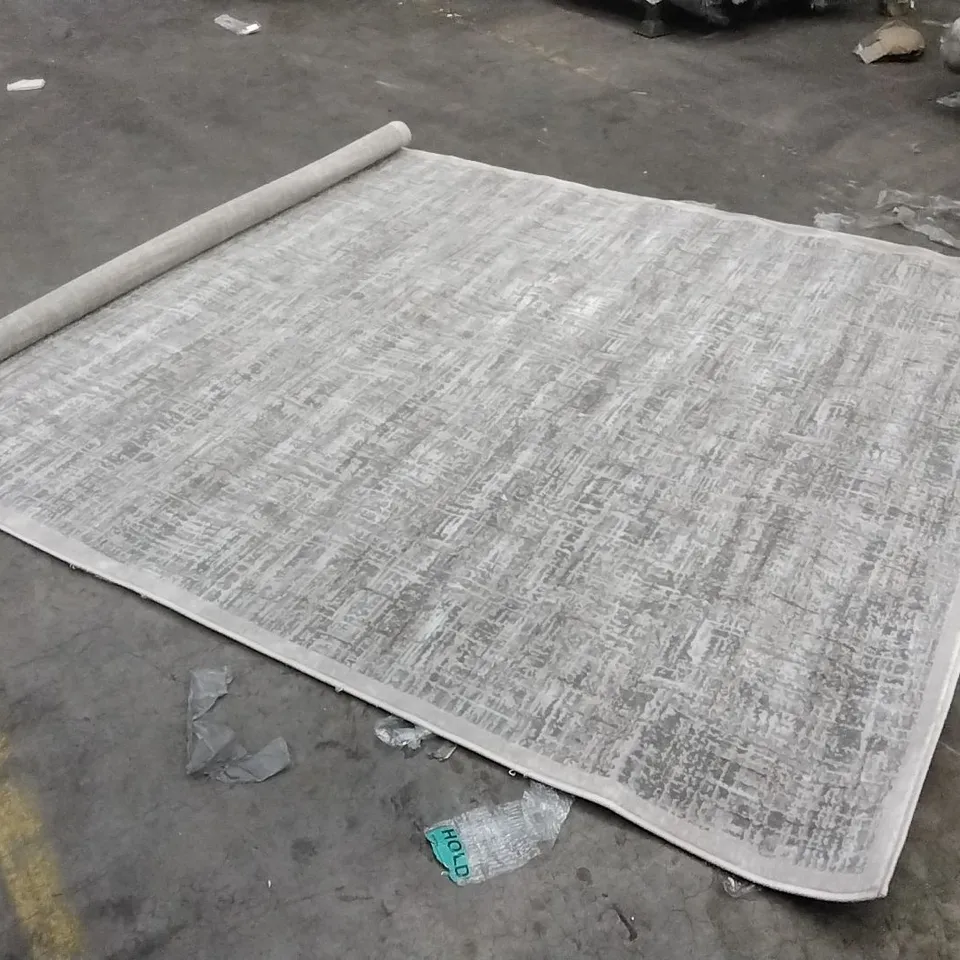 STILLAGE OF APPROXIMATELY 30 DESIGNER RUGS