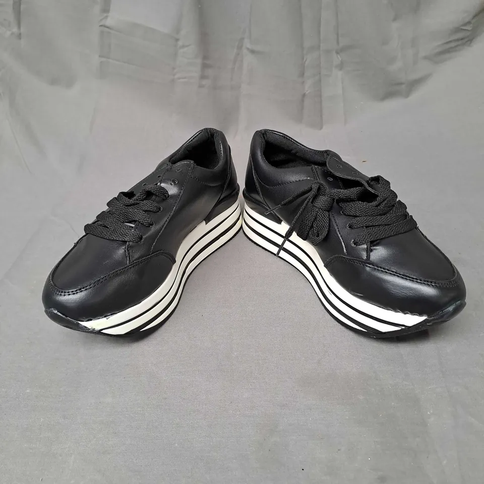 BOX OF APPROXIMATELY 12 PAIRS OF PLATFORM TRAINERS IN BLACK/WHITE - VARIOUS SIZES