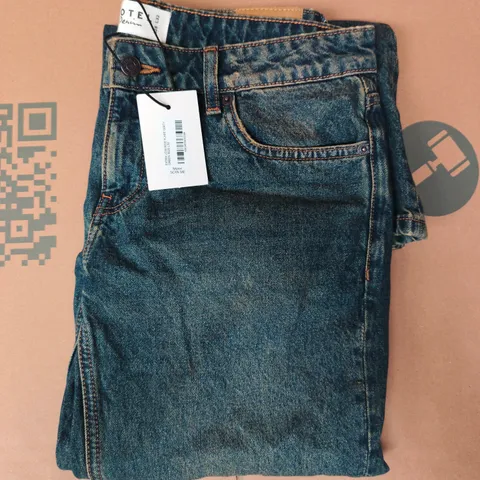 MOTEL EXTRA LOW RISE FLARE JEANS IN DIRTY BLUE SIZE W28/L32