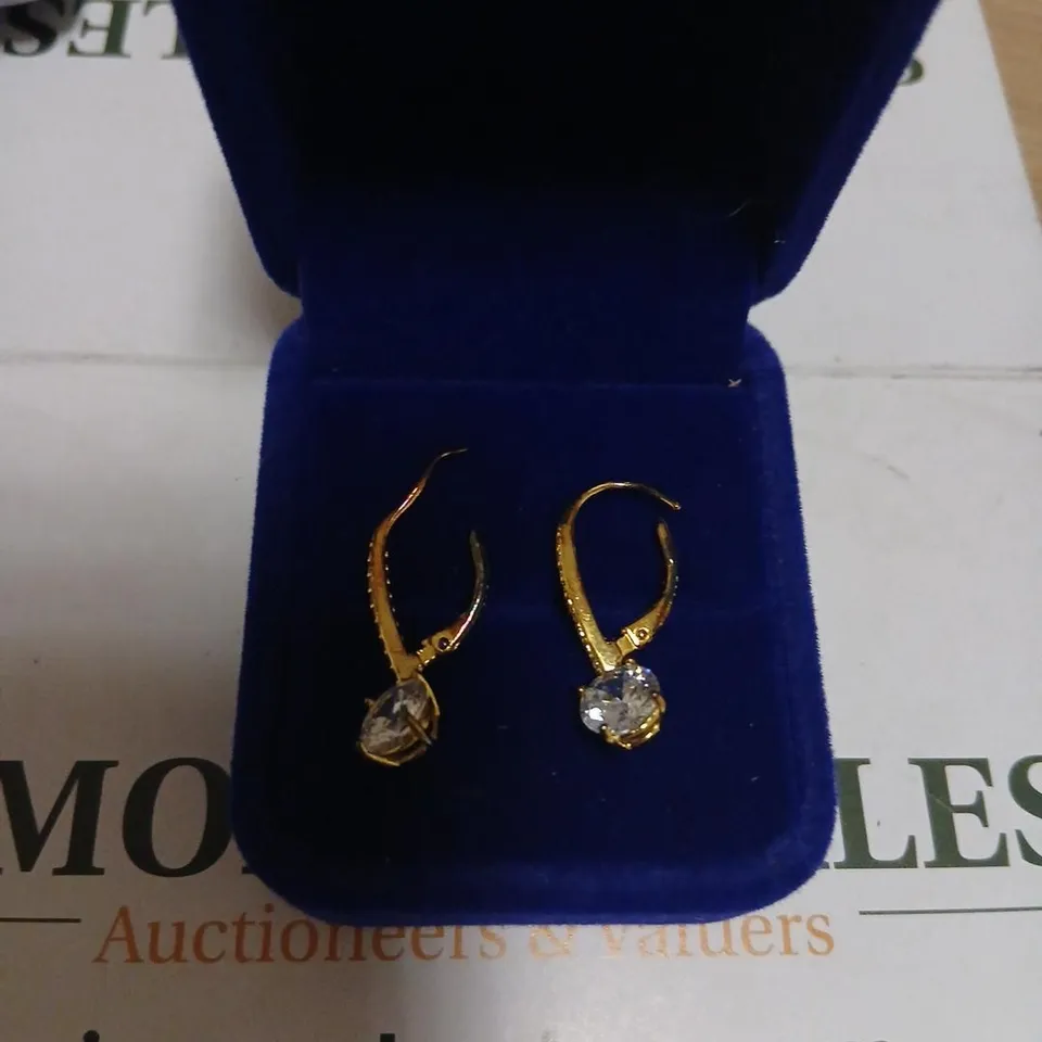 Gold-tone drop earrings with clear stones