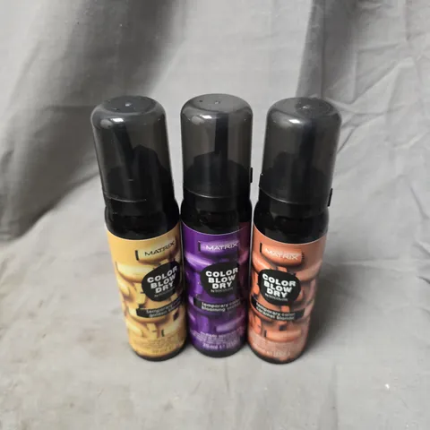 APPROXIMATELY 20 ASSORTED MATRIX BLOW DRY SPRAYS TO INCLUDE CARAMEL BLONDE, BLOOMING ORCHID, GOLDEN BLONDE, ETC - COLLECTION ONLY