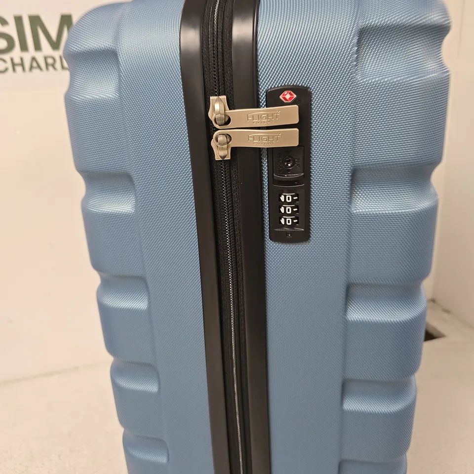 FLIGHT BLUE HARD-SHELL SUITCASE WITH FOUR WHEELS AND BUILT-IN COMBINATION LOCK