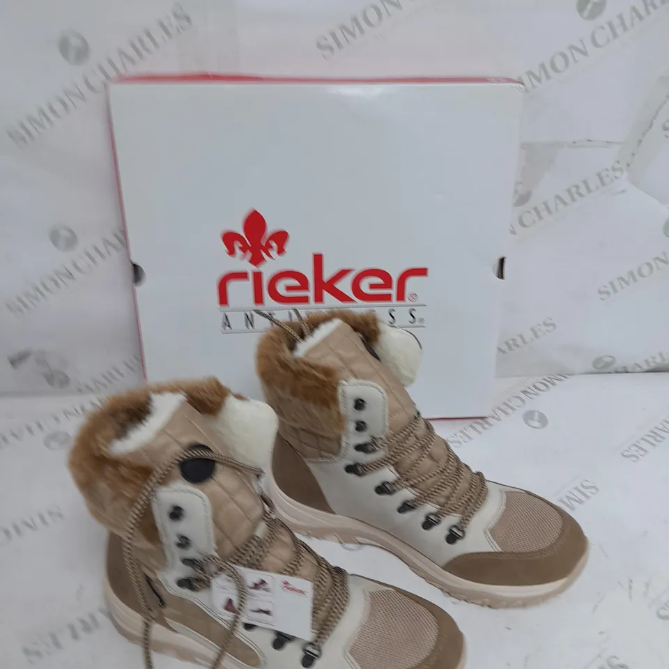 BOXED PAIR OF RIEKER CREAM WINTER FUR HIKE BOOTS IN SIZE 6