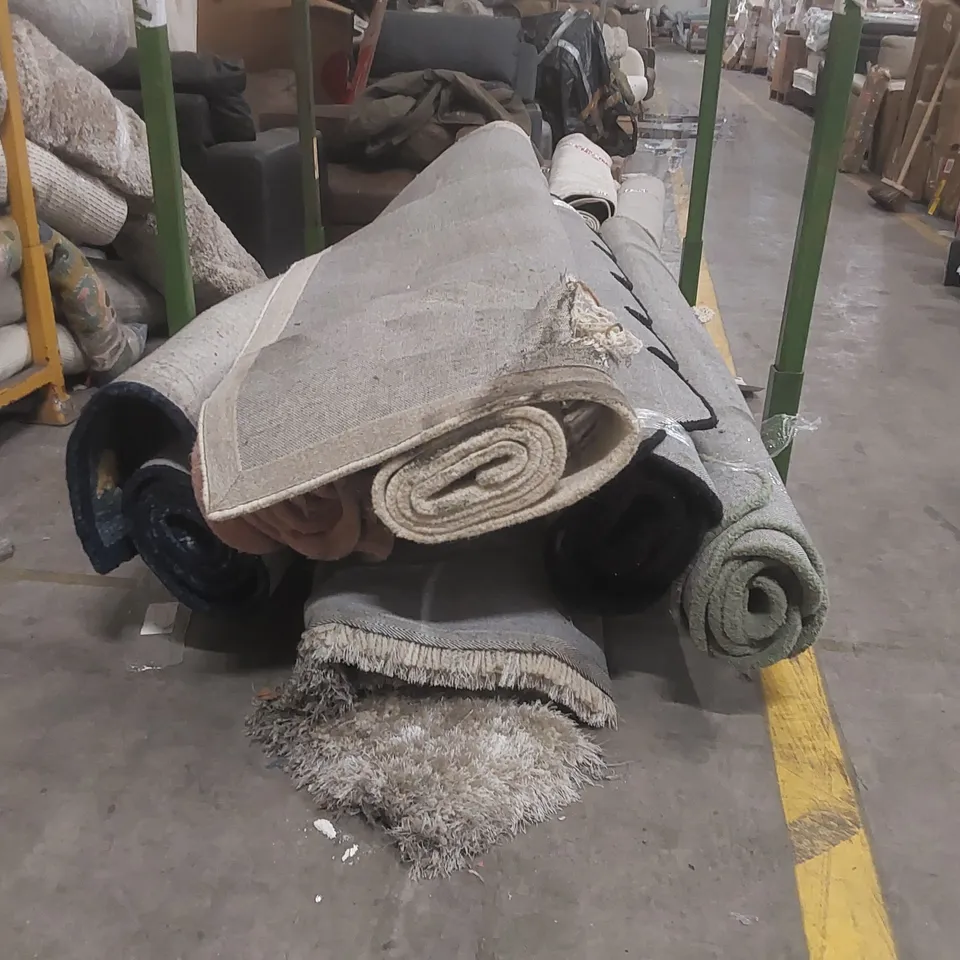 STILLAGE CONTAINING 6x DAMAGED DESIGNER RUGS