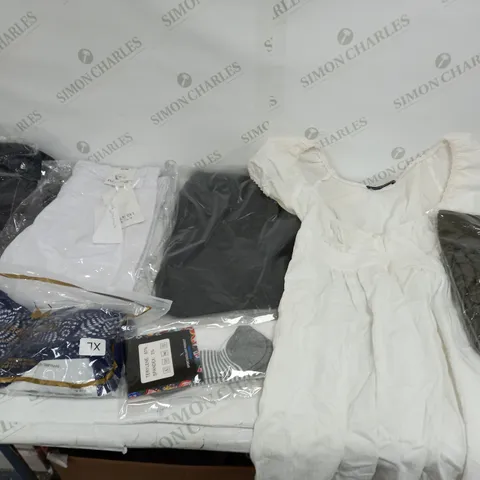 LARGE BOX OF ASSORTED CLOTHING ITEMS IN VARIOUS COLOURS AND SIZES INCLUDING TROUSERS , TOPS AND JUMPERS