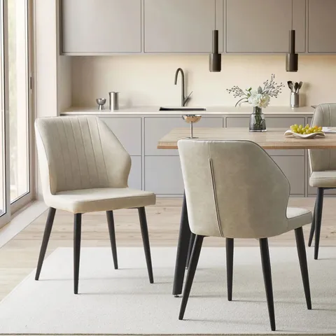 BOXED PAIR OF CREAM FAUX LEATHER UPHOLSTERED SIDE CHAIRS