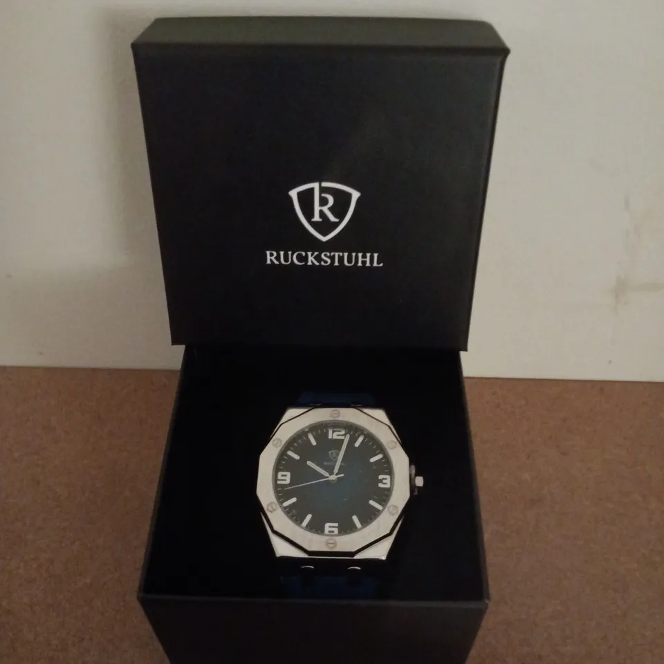 RUCKSTUHL SILVER COLOUR WRISTWATCH WITH NAVY RUBBER STRAP