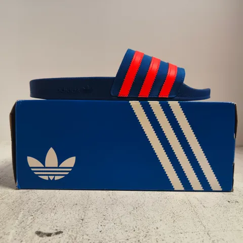 BOXED PAIR OF ADIDAS ADILETTE SLIDES IN BLUE/ORANGE SIZE UK 9