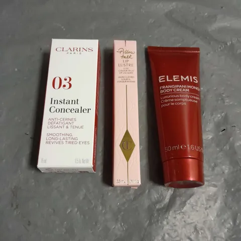 LOT OF 3 COSMETIC PRODUCTS TO INCLUDE - ELEMIS FRANGIPANI MONOI BODY CREAM - CLARINS PARIS INSTANT CONCEALER - CHARLOTTE TILBURY LIP LUSTRE