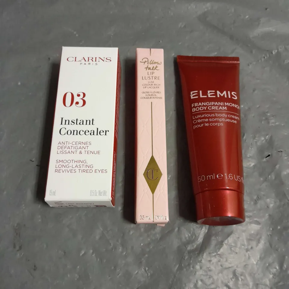 LOT OF 3 COSMETIC PRODUCTS TO INCLUDE - ELEMIS FRANGIPANI MONOI BODY CREAM - CLARINS PARIS INSTANT CONCEALER - CHARLOTTE TILBURY LIP LUSTRE