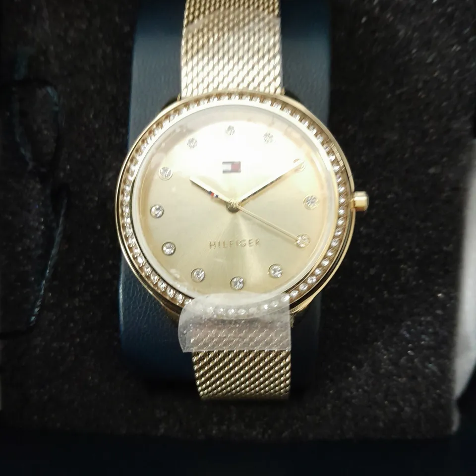 BOXED TOMMY HILFIGER WOMEN'S GOLD PLATED MESH WATCH WITH A CRYSTAL BEZEL