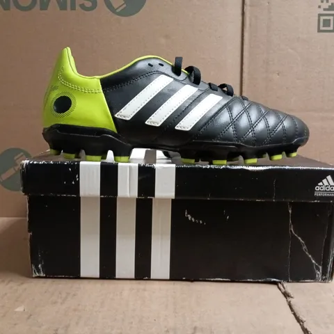 BOXED PAIR OF ADIDAS 11NOVA TRX AG J FOOTBALL BOOTS IN BLACK/LIME SIZE UK 5.5