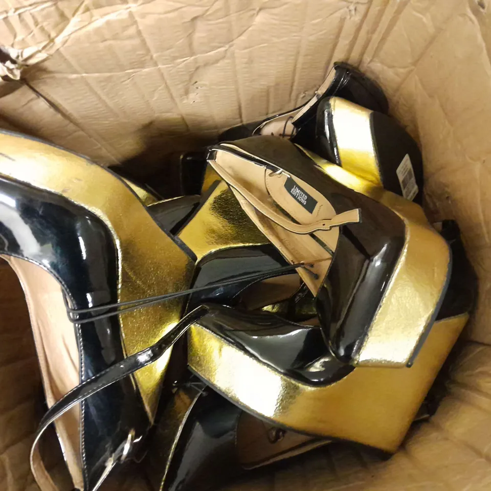 APPROXIMATELY 8 ASSORTED LOOSE PAIRS OF PRIMARK RAISED FOOT HEELS IN BLACK/GOLD IN VARIOUS SIZES
