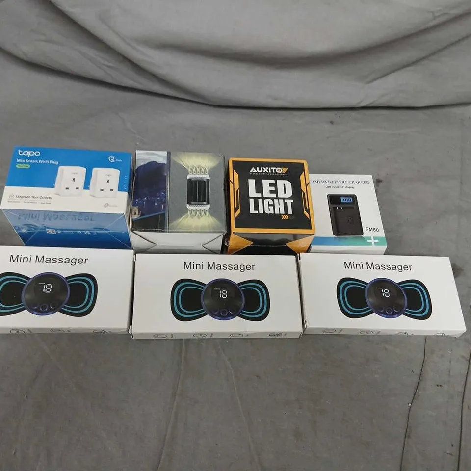 ASSORTED HOME ELECTRONICS BUNDLE – 7 BOXED ITEMS (3X MINI MASSAGER, TAPO SMART PLUG, AUXITO LED LIGHT, CAMERA BATTERY CHARGER)
