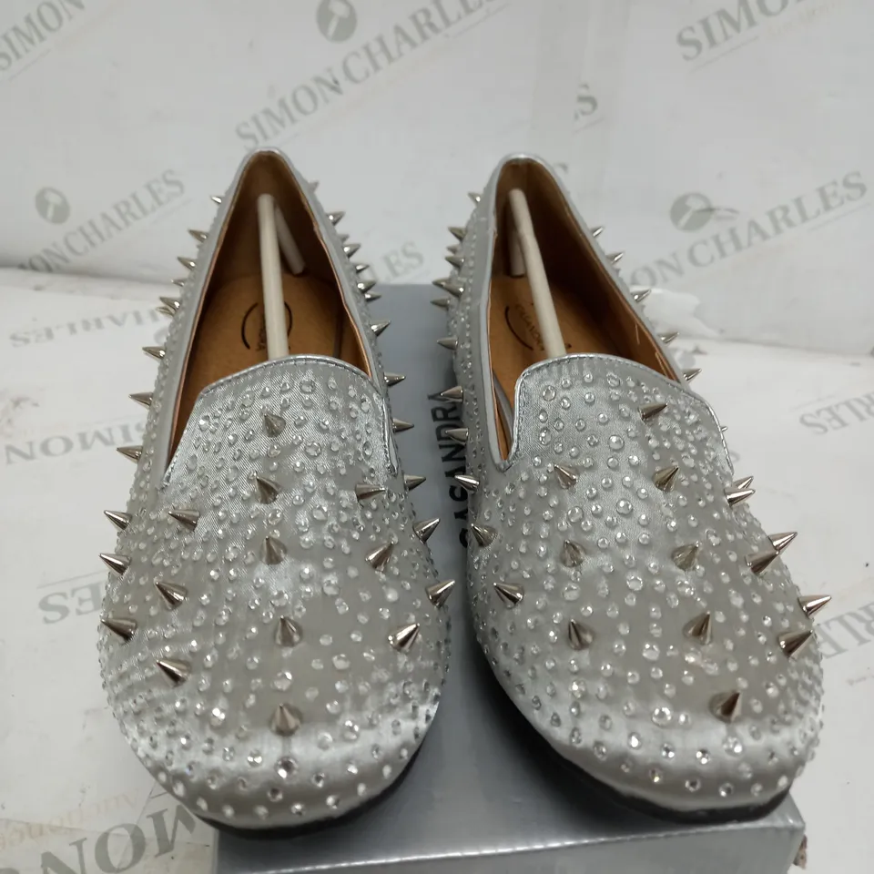 BOX OF APPROXIMATELY 7 CASANDRA FLAT SPIKED SILVER SATIN SHOES 