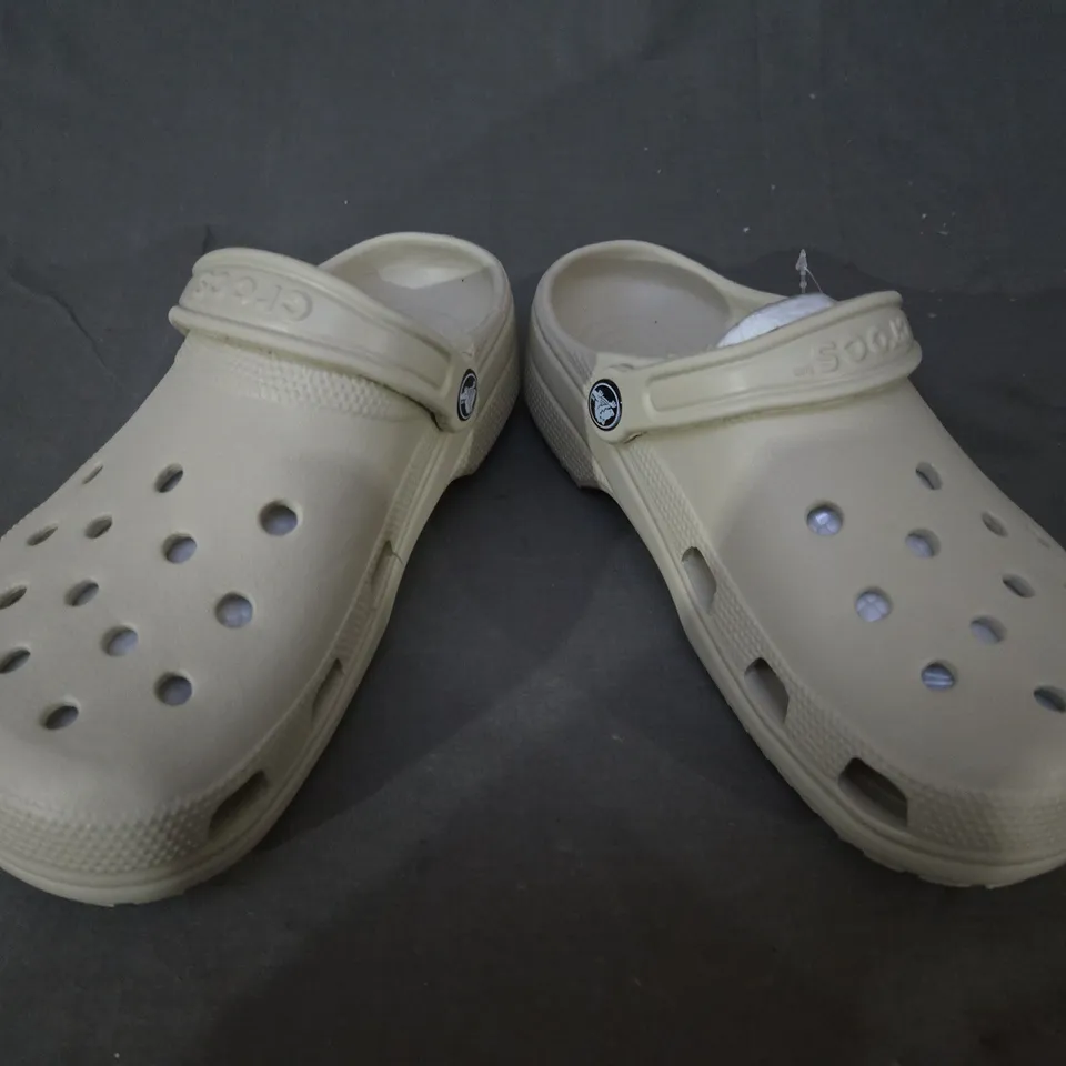 PAIR OF CROCS CLASSIC CLOGS IN BEIGE SIZE M5/W7