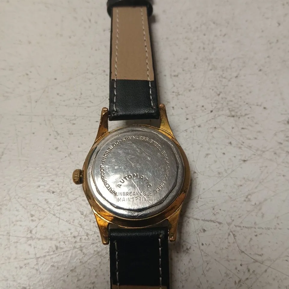 CURTISS AUTOMATIC WRISTWATCH – VINTAGE GOLD TONE CASE, BLACK LEATHER STRAP