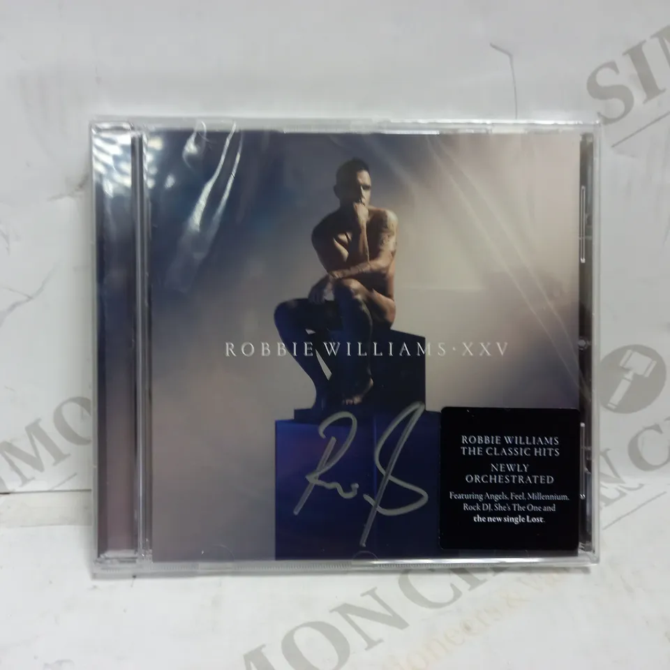 ROBBIE WILLIAMS XXV SIGNED ALBUM
