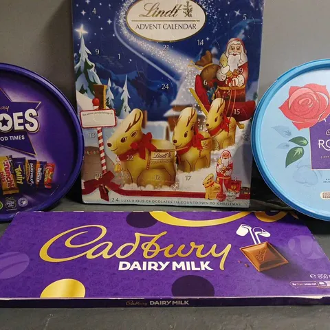 BOX OF APPROXIMATELY 10 FOOD ITEMS TO INCLUDE - CADBURY HEROS , CADBURYS DAIRY MILK , CADBURYS ROSES ETC