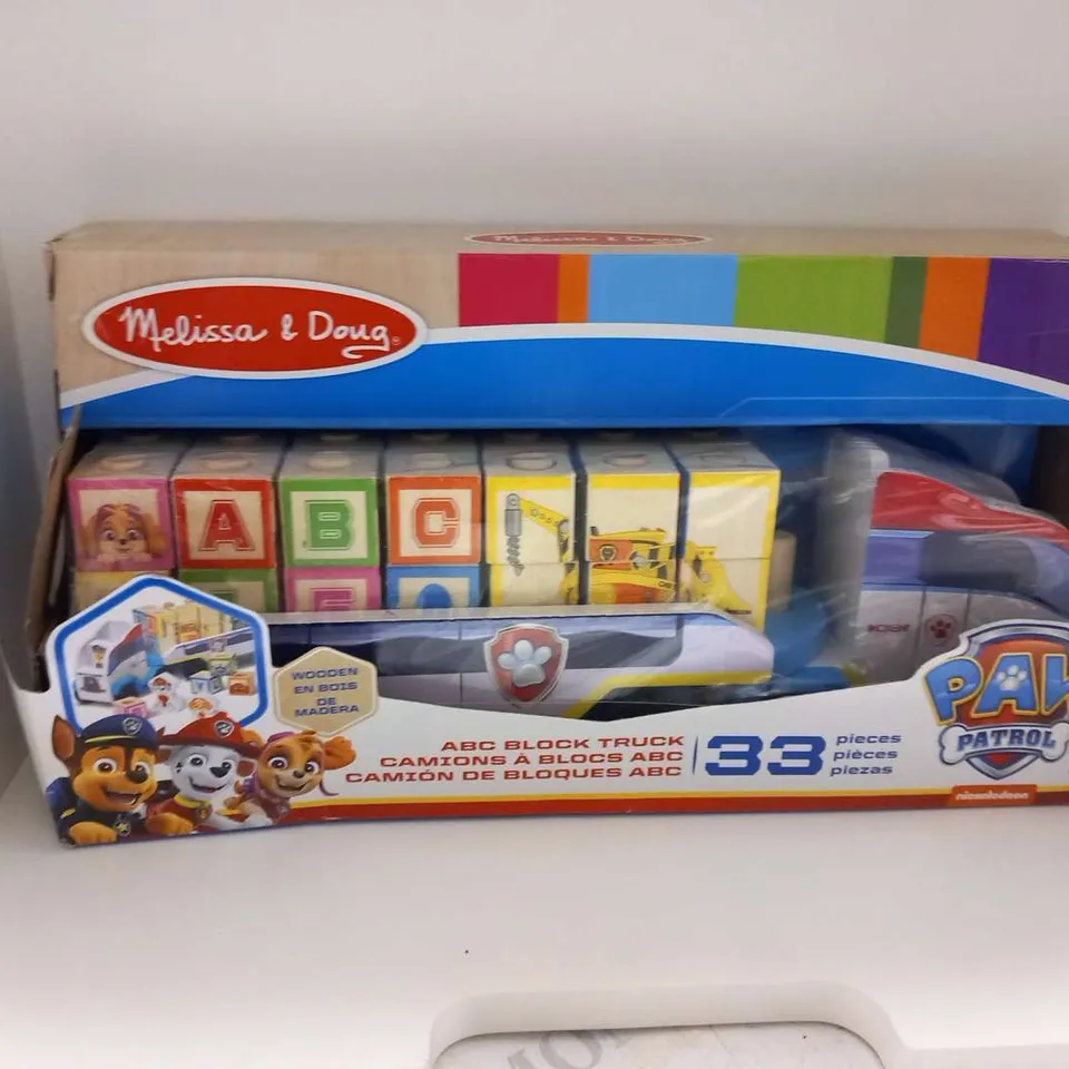 THREE ASSORTED TOYS TO INCLUDE; MELISSA AND DOUG PAW PATROL ABC BLOCK TRUCK, GUESS WHO THE ORIGINAL GUESSING GAME AND MEGA BLOCKS