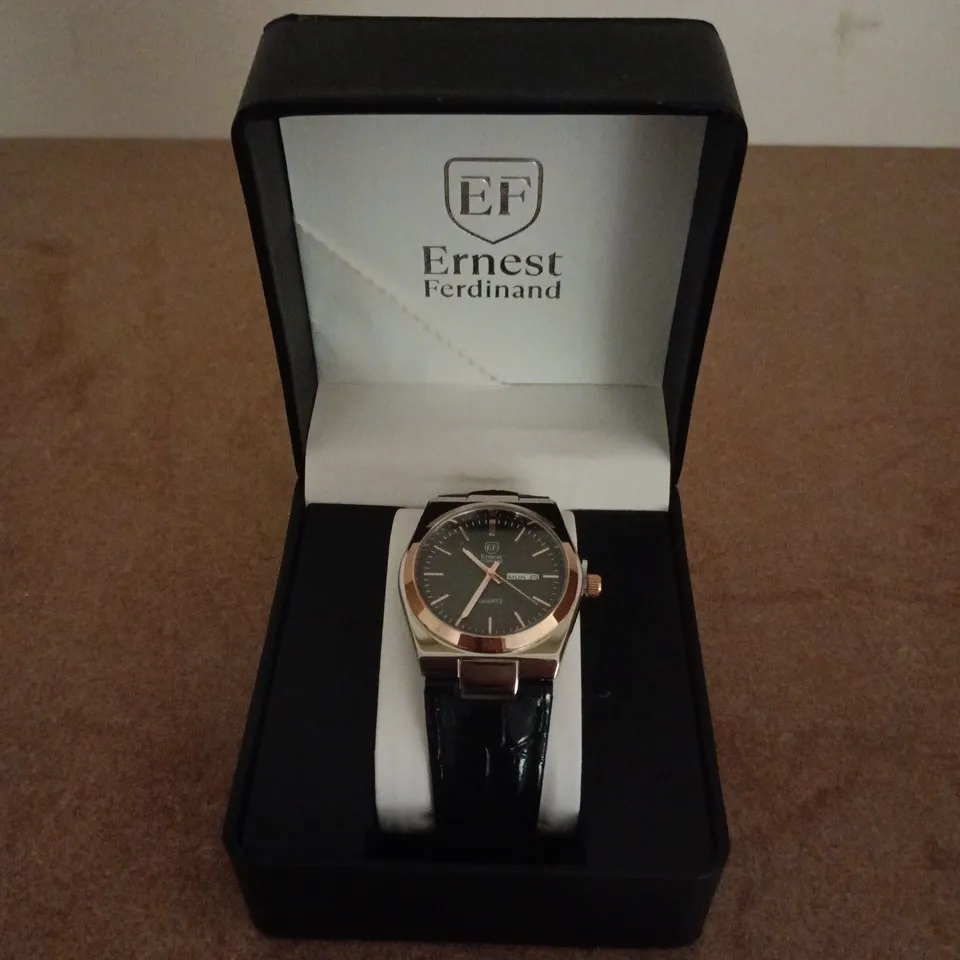 ERNEST FERDINAND QUARTZ WRISTWATCH – BLACK DIAL, ROSE GOLD COLOUR BEZEL, LEATHER STRAP