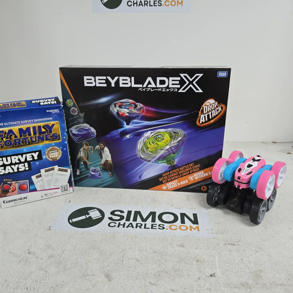 APPROXIMATELY 8 ASSORTED TOYS & GAMES PRODUCTS TO INCLUDE BEYBLADEX, STUNT FLIP CARS, FAMILY FORTUNES SURVEY SAYS, ETC