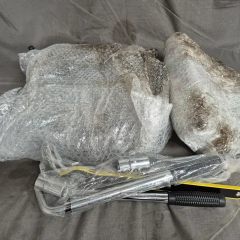 TOTE OF ASSORTED CAR ITEMS TO INCLUDE TOOLS , LOGOS AND VALVE CORES 