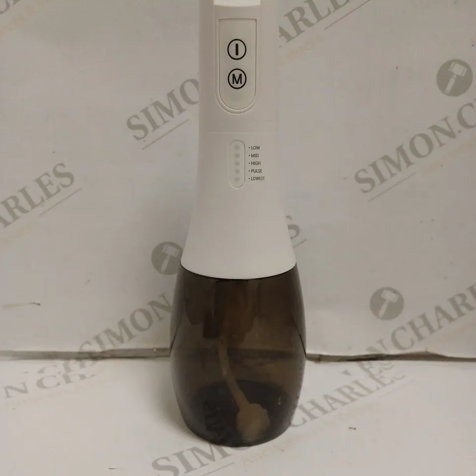 BOXED PORTABLE ORAL IRRIGATOR.