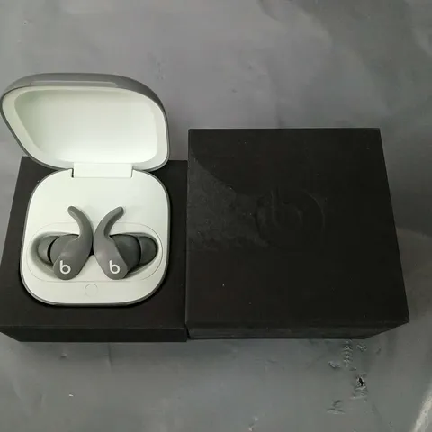 set of beats wireless earbuds in charging case