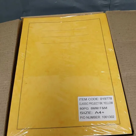 APPROXIMATELY 30 YELLOW EXERCISE BOOKS